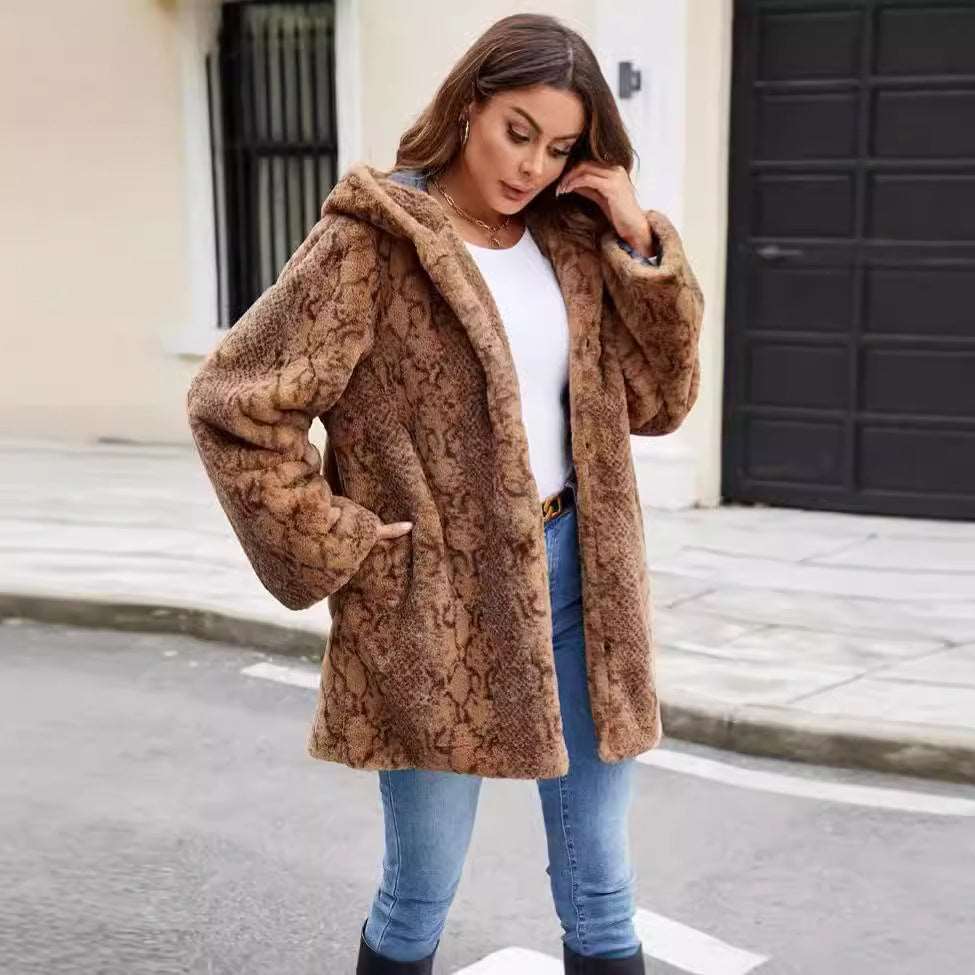 A stylish Animal Print Faux Fur Coat for women. this piece adds a touch of elegance to your outfit - Brinxx Couture