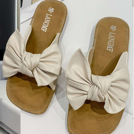 A stylish Bow Leather Flat Sandals for women. this piece adds a touch of elegance to your outfit - Brinxx Couture