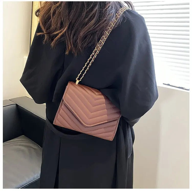 A stylish Chevron Crossbody Handbag for women. this piece adds a touch of elegance to your outfit - Brinxx Couture