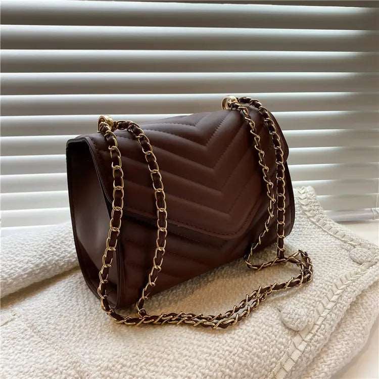 A stylish Chevron Crossbody Handbag for women. this piece adds a touch of elegance to your outfit - Brinxx Couture