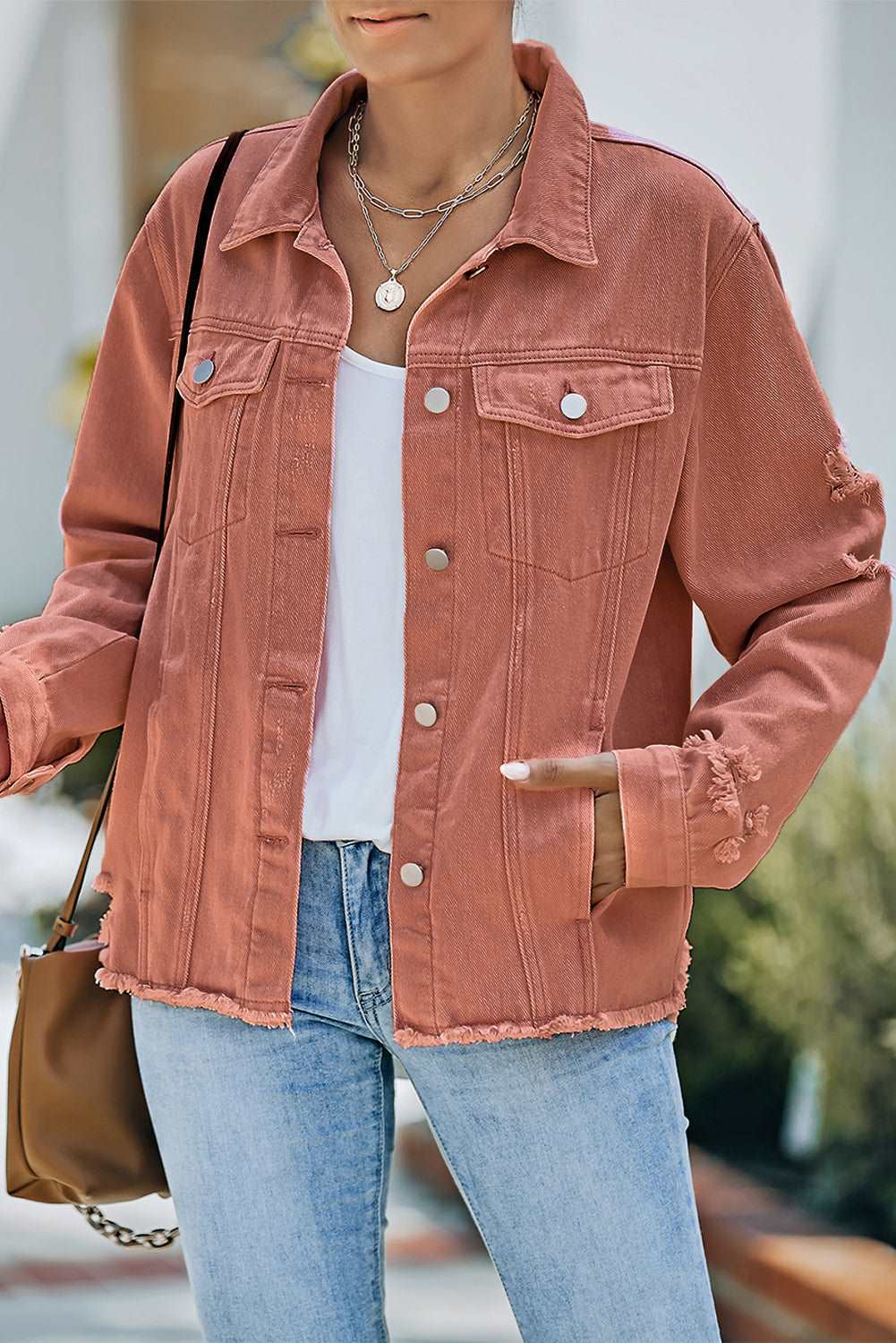 A stylish Distressed Raw Hem Denim Jacket for women. this piece adds a touch of elegance to your outfit - Brinxx Couture