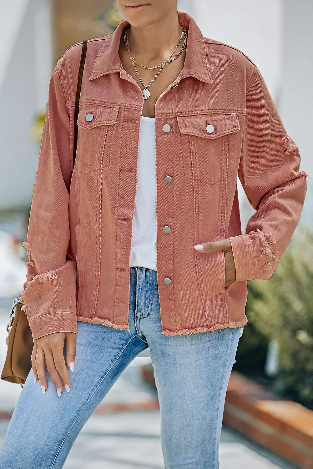 A stylish Distressed Raw Hem Denim Jacket for women. this piece adds a touch of elegance to your outfit - Brinxx Couture