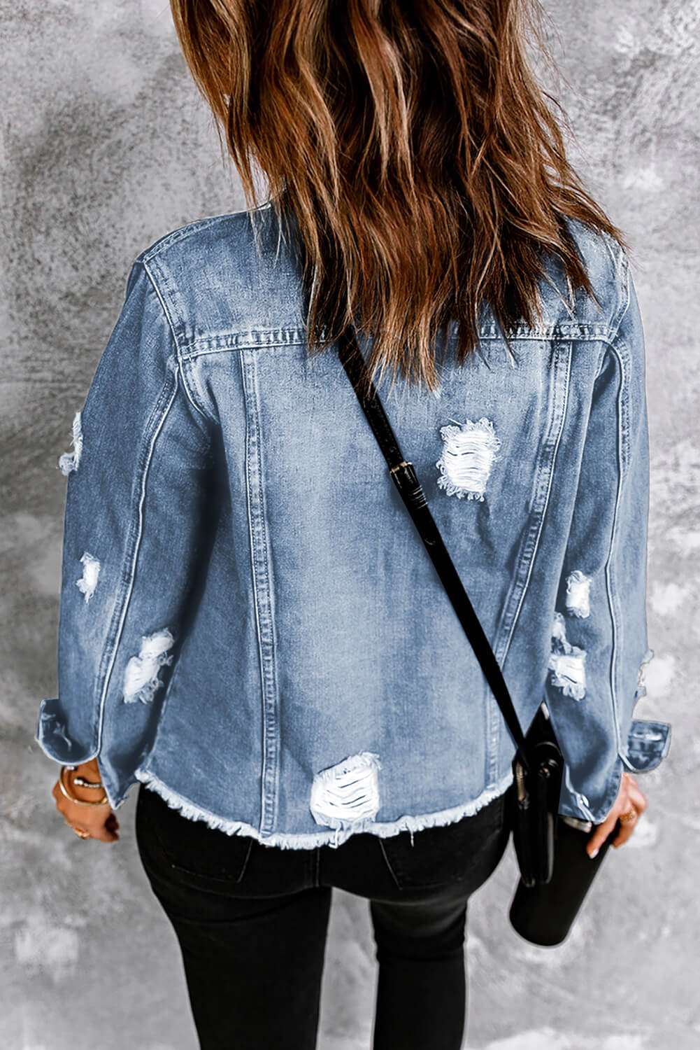 A stylish Distressed Raw Hem Denim Jacket for women. this piece adds a touch of elegance to your outfit - Brinxx Couture