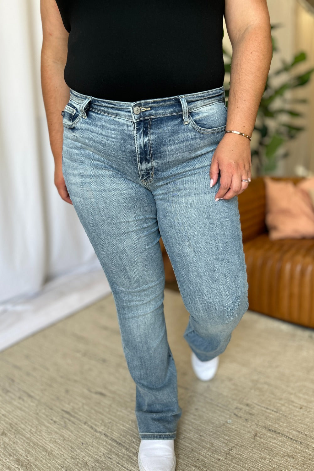 A stylish Judy Blue Medium Rise Bootcut Jeans for women. this piece adds a touch of elegance to your outfit - Brinxx Couture