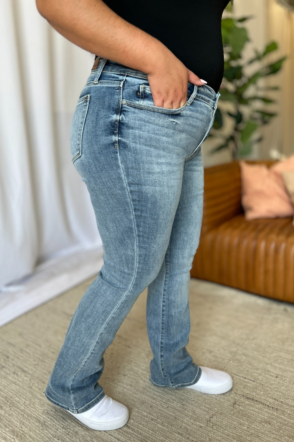 A stylish Judy Blue Medium Rise Bootcut Jeans for women. this piece adds a touch of elegance to your outfit - Brinxx Couture