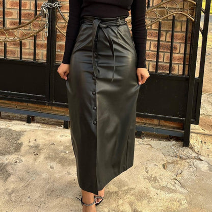 A stylish Faux Leather Buckle Slit Leather Belted Skirt for women. this piece adds a touch of elegance to your outfit - Brinxx Couture