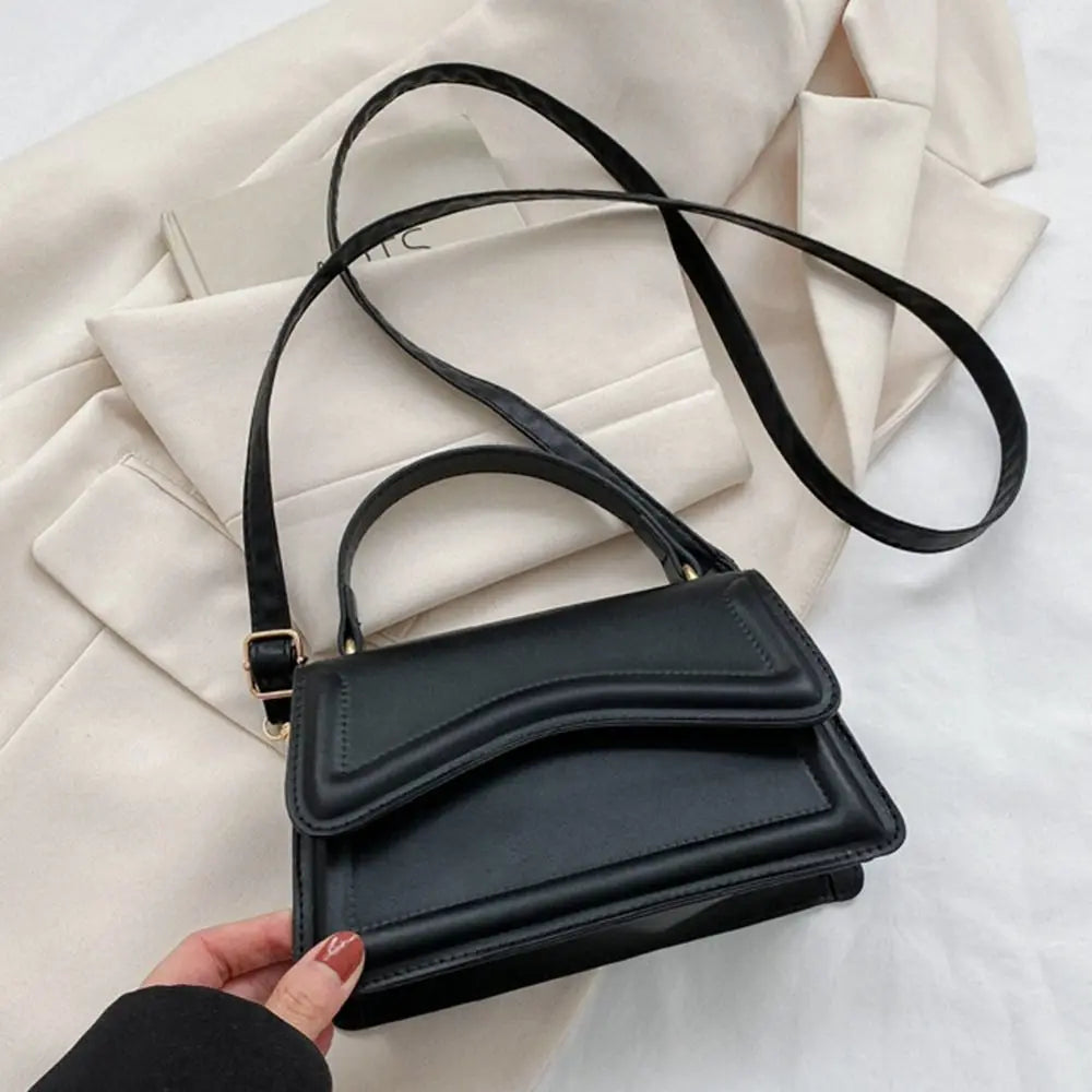 A stylish PU Leather Sling Shoulder Bag for women. this piece adds a touch of elegance to your outfit - Brinxx Couture