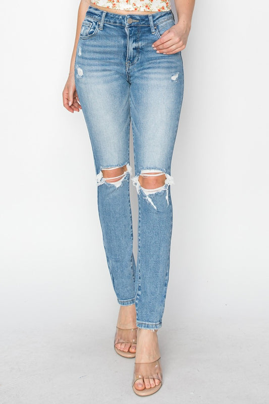 A stylish Risen High Rise Distressed Skinny Jeans for women. this piece adds a touch of elegance to your outfit - Brinxx Couture