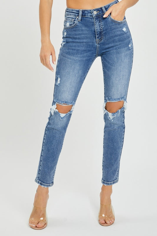 A stylish Risen High Rise Distressed Skinny Jeans for women. this piece adds a touch of elegance to your outfit - Brinxx Couture