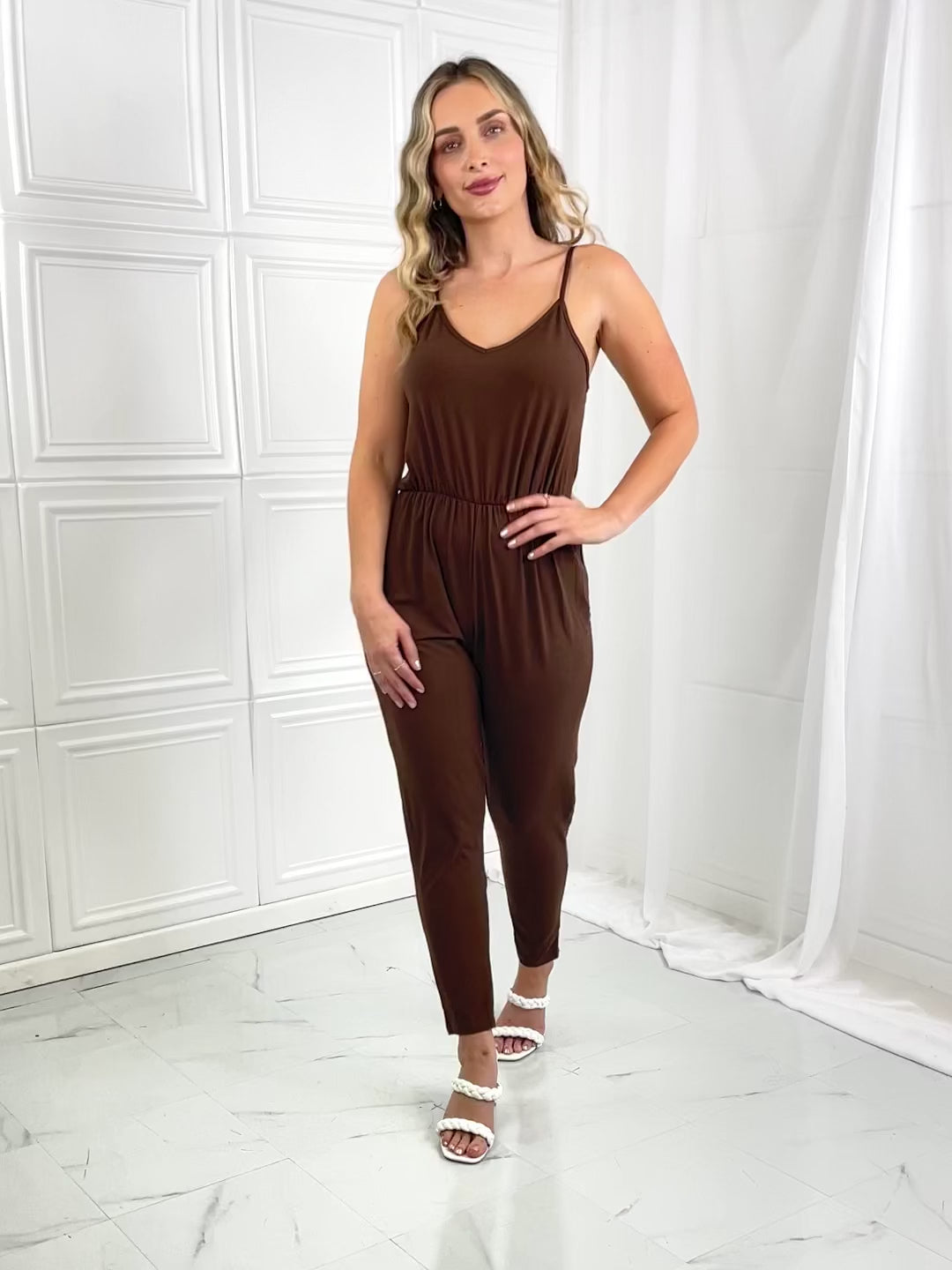 Model wearing brown Elastic Waistband Jumpsuit posing- Brinxx Couture